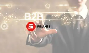 Dłoń dotyka ekranu z napisem B2B i ikoną finansów. To klucz do zrozumienia, b2b co to jest.